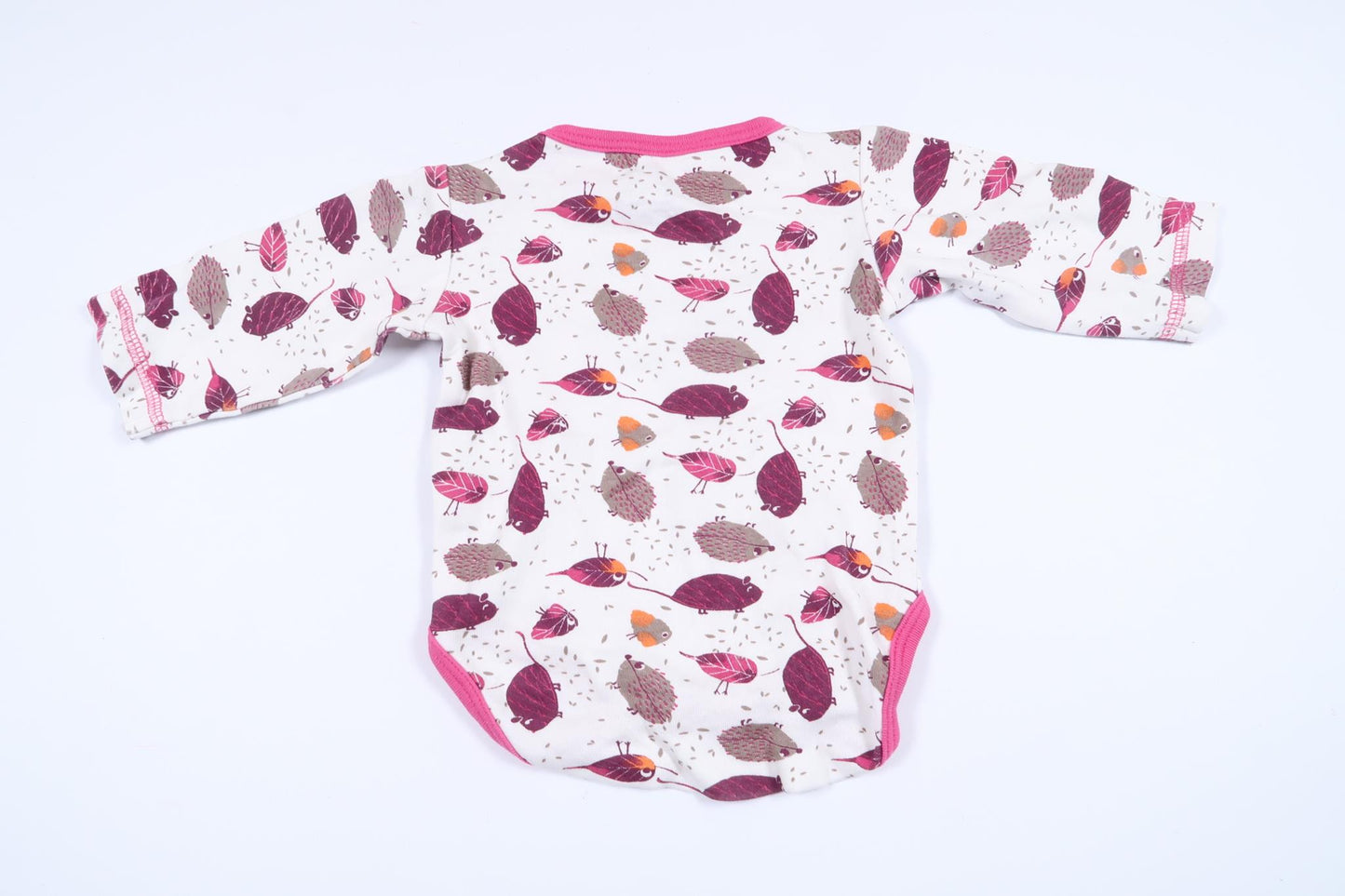 White long-sleeved bodysuit with animals from Minikids in size 50/56