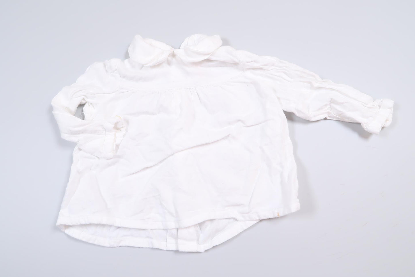 White long-sleeved blouse from Zara in size 68