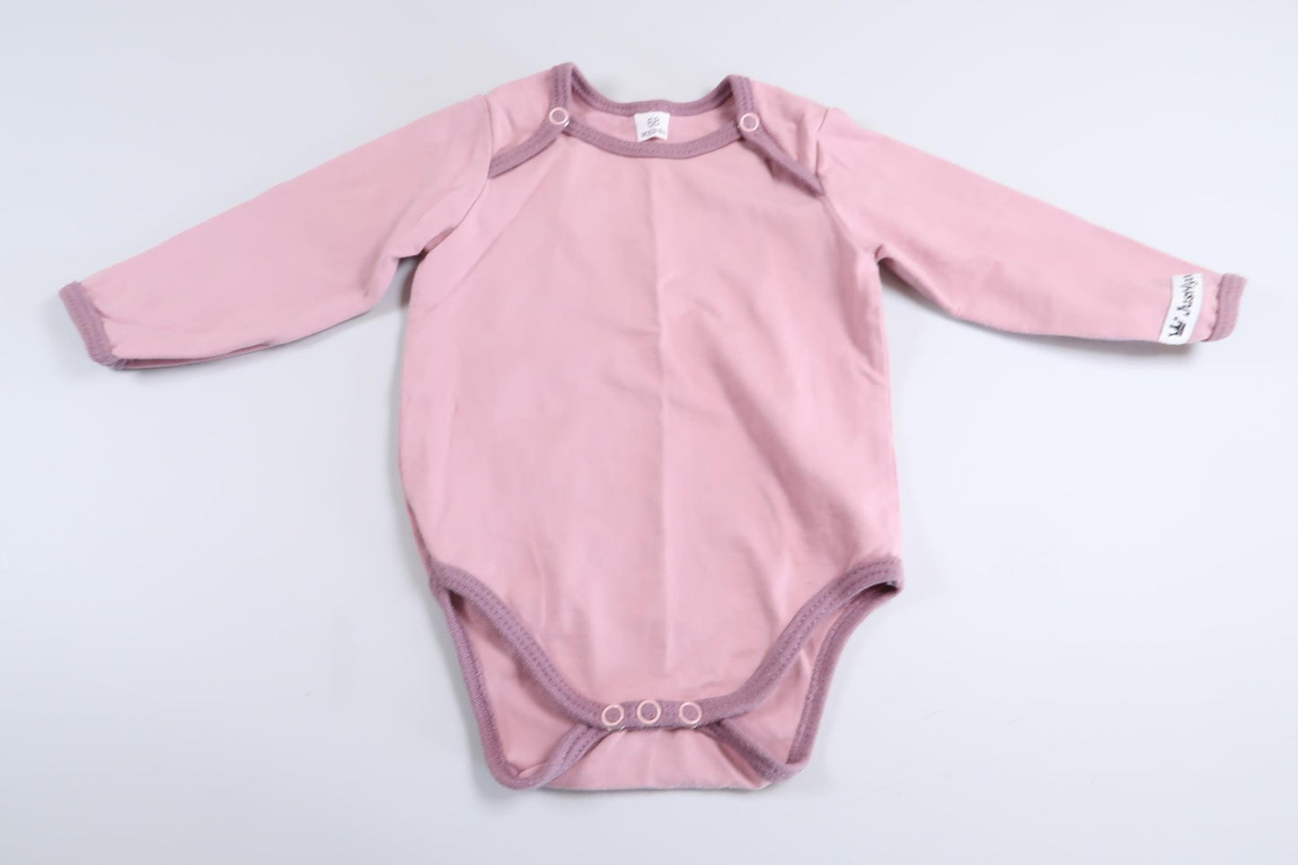 Pink long-sleeved bodysuit in size 68
