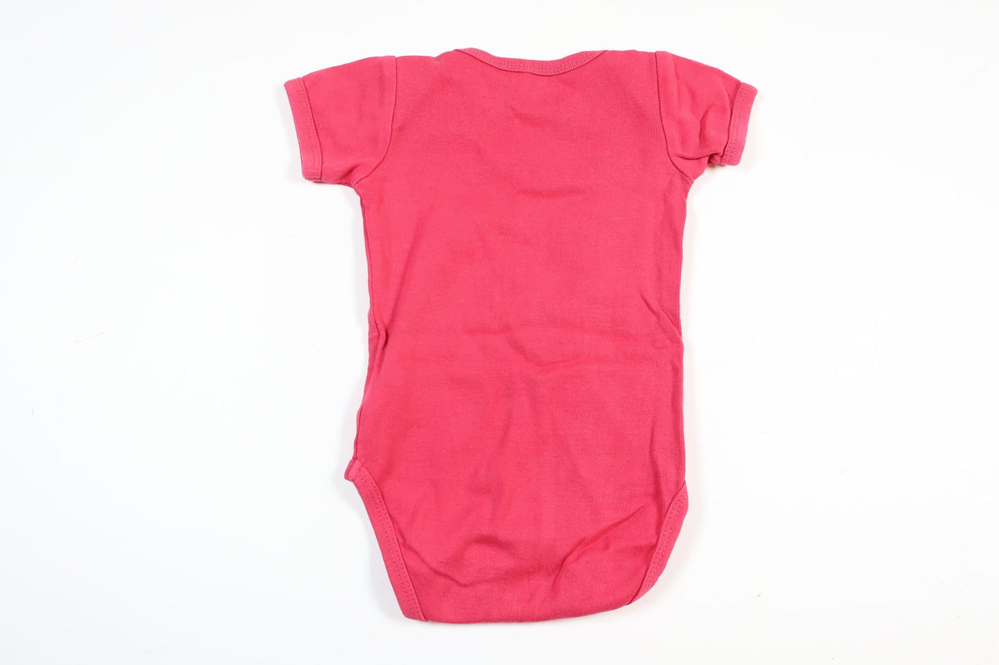 Pink short-sleeved bodysuit from Name It in size 62