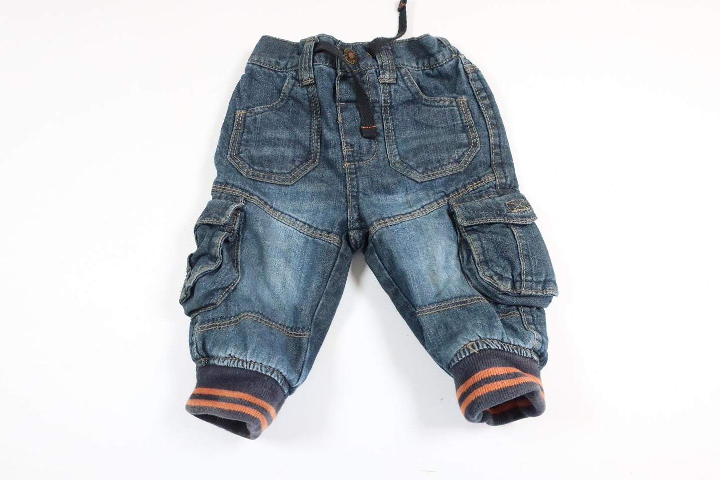 Put on lightly lined jeans from Early Days in size 3-6 M.
