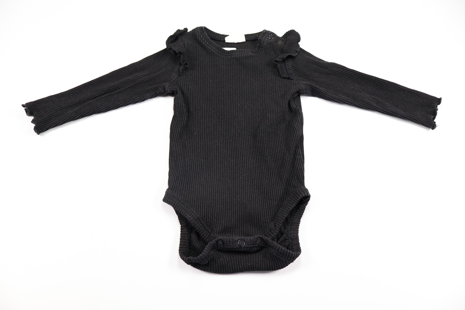 Ribbed bodysuit with ruffle from Kappahl - Size 74 - Black