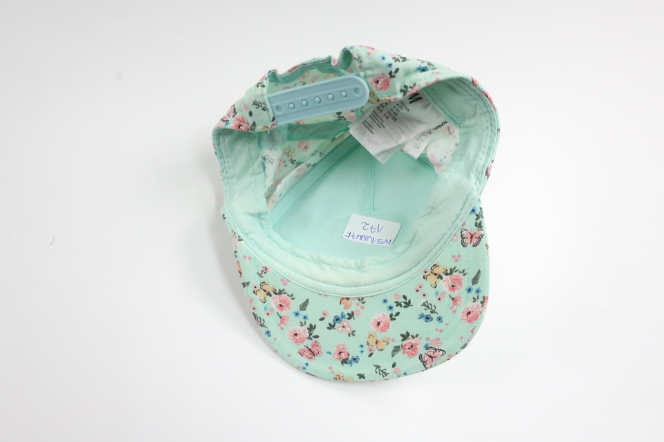 Blommig keps från H&M - Storlek 110/128 - Blå
